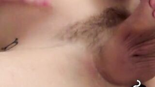 Attractive twink jerks off huge dick while blowing smoke