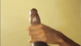 Black guy jacks off his big cock and cums hard