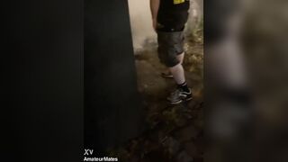 Helping him urinate in the street